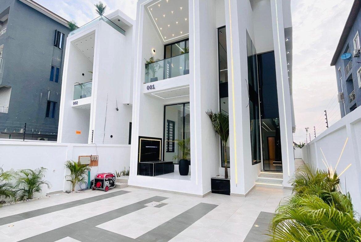 Contemporary white duplex facade within a tiled residential compound in Lekki, Nigeria